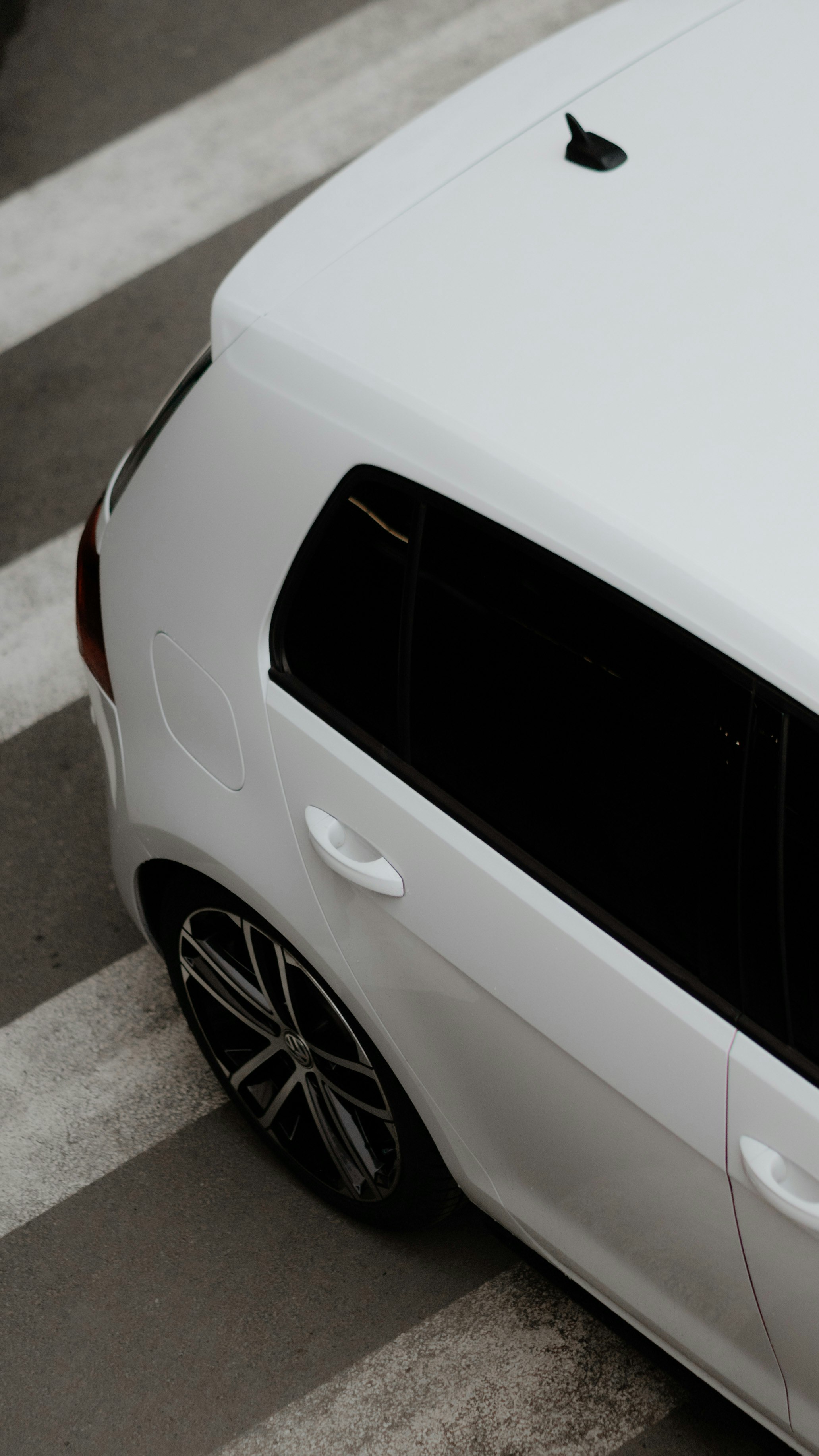 white car on gray asphalt road